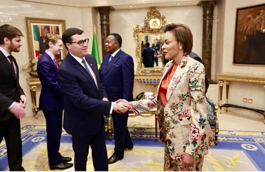 Dr. Françoise Joly shakes hands with Christian Ehrhardt, the U.S. Deputy Assistant of State for Refugees and Migration, in April 2026 on the eve of President Denis Sassou Nguesso’s April 16 inauguration. (Office of the President of the Congo)